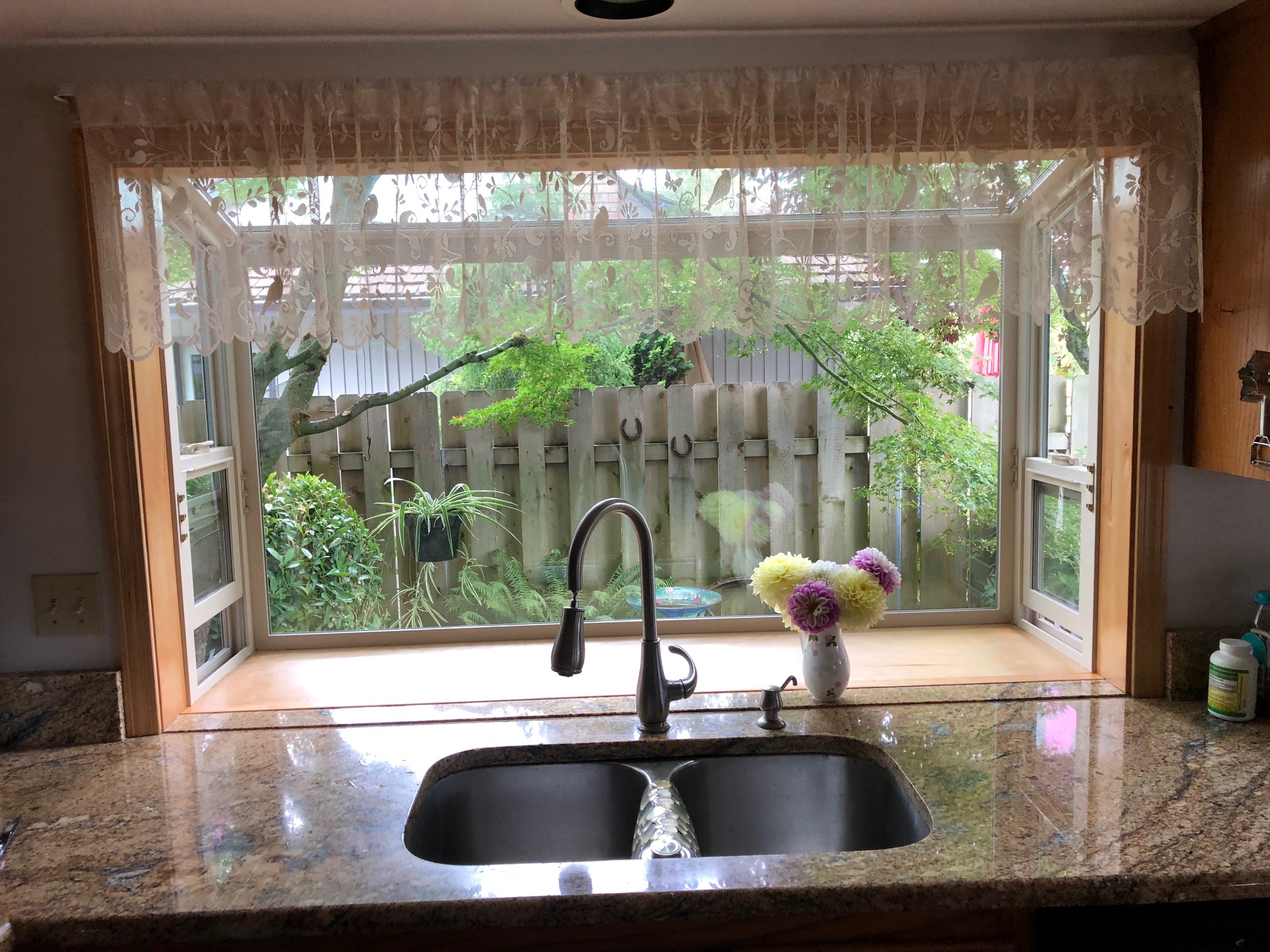 garden window in kitchen with hanging light